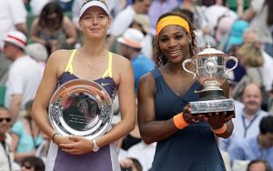 Jun 8, 2013; Paris, France; Serena Williams (USA), right, and Maria Sharapova (RUS) pose with their trophies after their match on day 14 of the 2013 French Open at Roland Garros. Mandatory Credit: Susan Mullane-USA TODAY Sports
