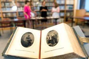 5/07/15 Students research lost Special Collections' photo album.