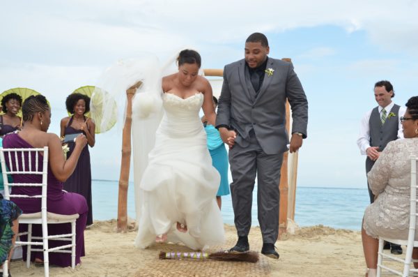 Couple Jumping The Broom 