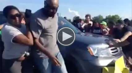 Anger Boils Over as Driver Attempts to Drive Through Ferguson Protesters