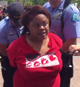 Prominent activist, Netta Elzie, being arrested for filming the protest