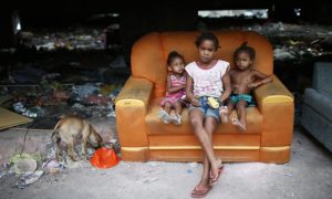 Children in one of the largest favela complexes in Rio de Janeiro, Brazil. Thousands are being displaced ahead of 2016 Olympics and losing access to social services. (Mario Tama/Getty Images)