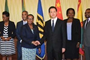Barbados Minister of Foreign Affairs and Foreign Trade, Senator Maxine McClean shakes hands with China’s Vice Foreign Minister, Wang Choa