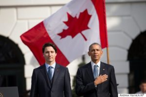 President Barack Obama and Canadian Prime Minister Justin Trudeau, stand for the playing of national anthems during an arrival ceremony on the South Lawn of the White House in Washington, Thursday, March 10, 2016. (AP Photo/Andrew Harnik)