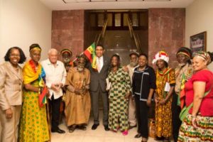 Prime Minister Andrew Holness (center) with members of the Rastafari Millennium Council following a meeting at Jamaica House 