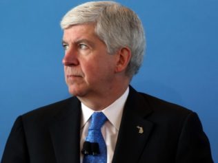 Michigan Governor, Other Officials Face Racketeering Lawsuit, Feds to Interview Flint Residents
