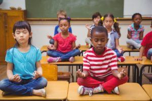 Researchers are teaching Chicago Public School students the art of mindfulness. Think stock.