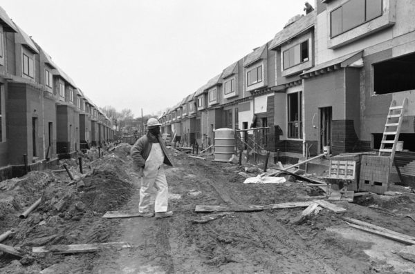 A workman walks down Osage Street on Dec. 5, 1985, amid continuing reconstruction in the neighborhood devastated by the deadly Philadelphia police confrontation with the group MOVE. Peter Morgan/AP