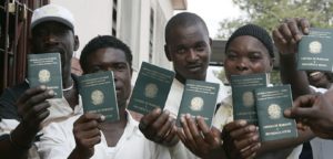 Haitian Immigrants show off their Brazilian passport (Photo via Borgen Magazine)