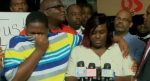 Cameron Sterling, 15, son of Alton Sterling, with his mother Quinyetta McMillon