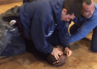 Bystanders Look On in Shock As 3 NYPD Cops Knees, Punches Man Already Pinned to the Ground