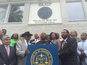 Ashton P. Woods of Black Lives Matter: Houston speaks out against the white supremacists' rally alongside NAACP - Houston President Dr. James Douglas (left) and U.S. Congressman Al Green (right). Image courtesy of the Houston Press. 