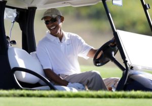 Pres. Obama on a golf course at Martha's Vineyard. Photo by Steven Senne/AP