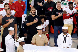 Colin Kaepernick kneels during national anthem (ESPN/Twitter)