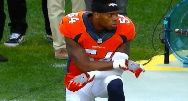 Brandon Marshall kneels during the national anthem at the NFL Kickoff game Thursday night