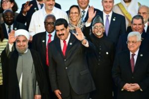 Iranian President Hassan Rouhani (L), Venezuelan President Nicolas Maduro (C) and Palestinian President Mahmoud Abbas (R) wave at the Non-Aligned Movement summit in Porlamar, Margarita Island, Venezuela, on September 17, 2016 Ronaldo Schemidt, AFP 