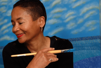 Legendary Artist Synthia Saint James Dishes About Her Career and USPS 50th Anniversary Kwanzaa Stamp