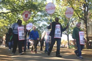 Food service workers march Wednesday on Harvard University's campus, marking the first strike on the Ivy League campus since 1983. Photo by Steven Porter. 