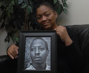 Venida Browder holds a photo of her late son, Kalief Browder, who committed suicide last year after serving time at Rikers Island. Image courtesy of SAM COSTANZA/FOR NEW YORK DAILY NEWS.