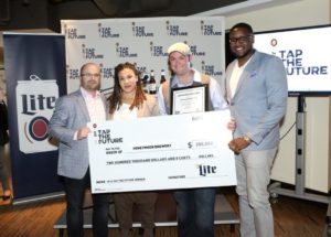 Ayala Bystrom-Williams and James Hill accept their check from Tap The Future (Miller Coors)