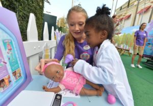 A young girl participates in Doc Mobile interactive tour (Disney Junior/Todd Wawrychuk/Disney/ABC Television Group Flickr/)