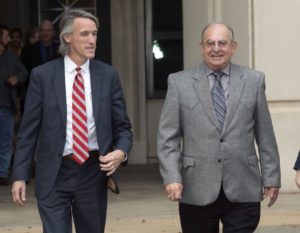 Louis Ackal (right) smiles as he leaves the U.S. District Court in Shreveport with his lawyer John McLindon following Friday's not guilty verdict. Photo by Douglas Collier.