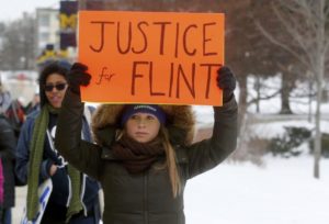 Demonstrators protest over the Flint, Mich., contaminated water crisis/ Photo by Rebecca Cook/Reuters.