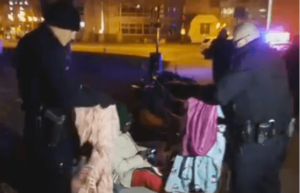 Denver police take blankets from homeless man (screen shot)