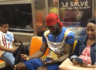 Man On NYC Subway Appears to Solve Rubik's Cube In Seconds with His Eyes Closed