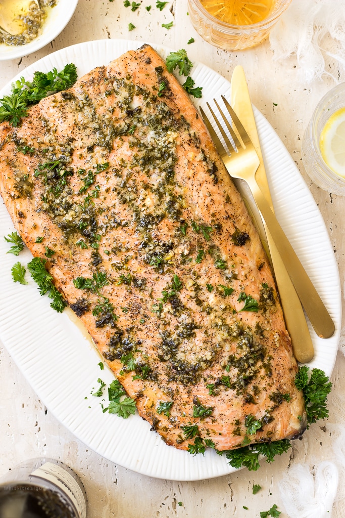 Flaky, tender, buttery melt in your mouth garlic side of salmon is great for those midweek dinner emergencies. You'll have dinner ready in 30 minutes or less! This garlic butter salmon is also perfect for the holidays or a date night dinner.