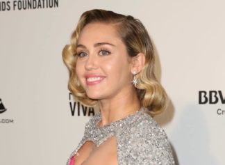 Miley Cyrus set social media ablaze with a daring Vogue France photo shoot featuring her in an outdoor shower wearing only Louboutin heels.