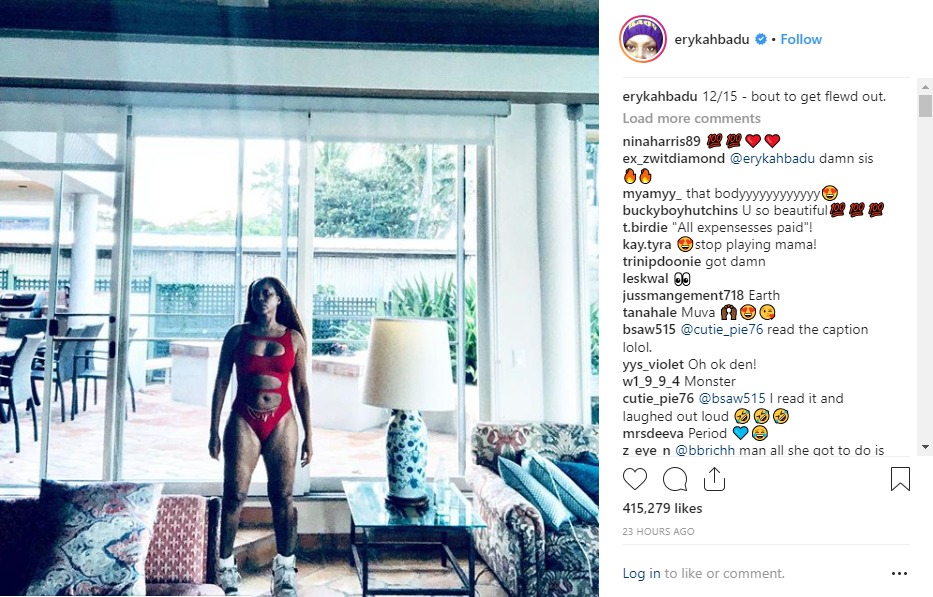 Erykah Badu posts photo of herself in red baiting suit and gets a huge reaction