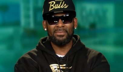 R. Kelly's former manager was issued an arrest warrant for threatening a parent of one of his accusers.
