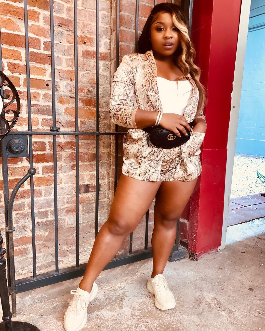 Reality star Reginae Carter shared a photo showing off her latest fashion–f...