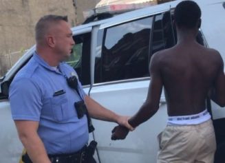 White cop grabs teen