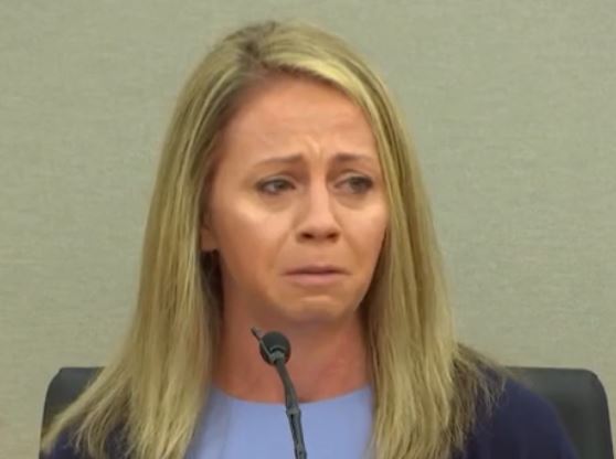 Woman cries on stand