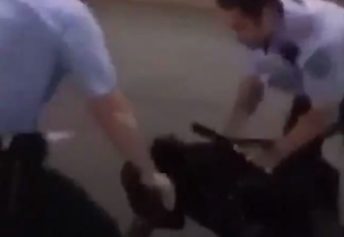 Cop hits Black man with flashlight