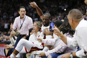John Legend and Chrissy Teigen Become an Instant Meme When Dwyane Wade Crashes Into Them in His Final Home Game Gabrielle Union Offers Compensation
