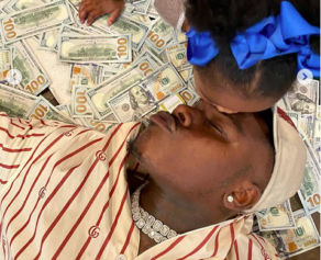 A Heartfelt Cringe': DaBaby Causes a Divide Among Fans After Posting Daughter Lying in a Pile of Money