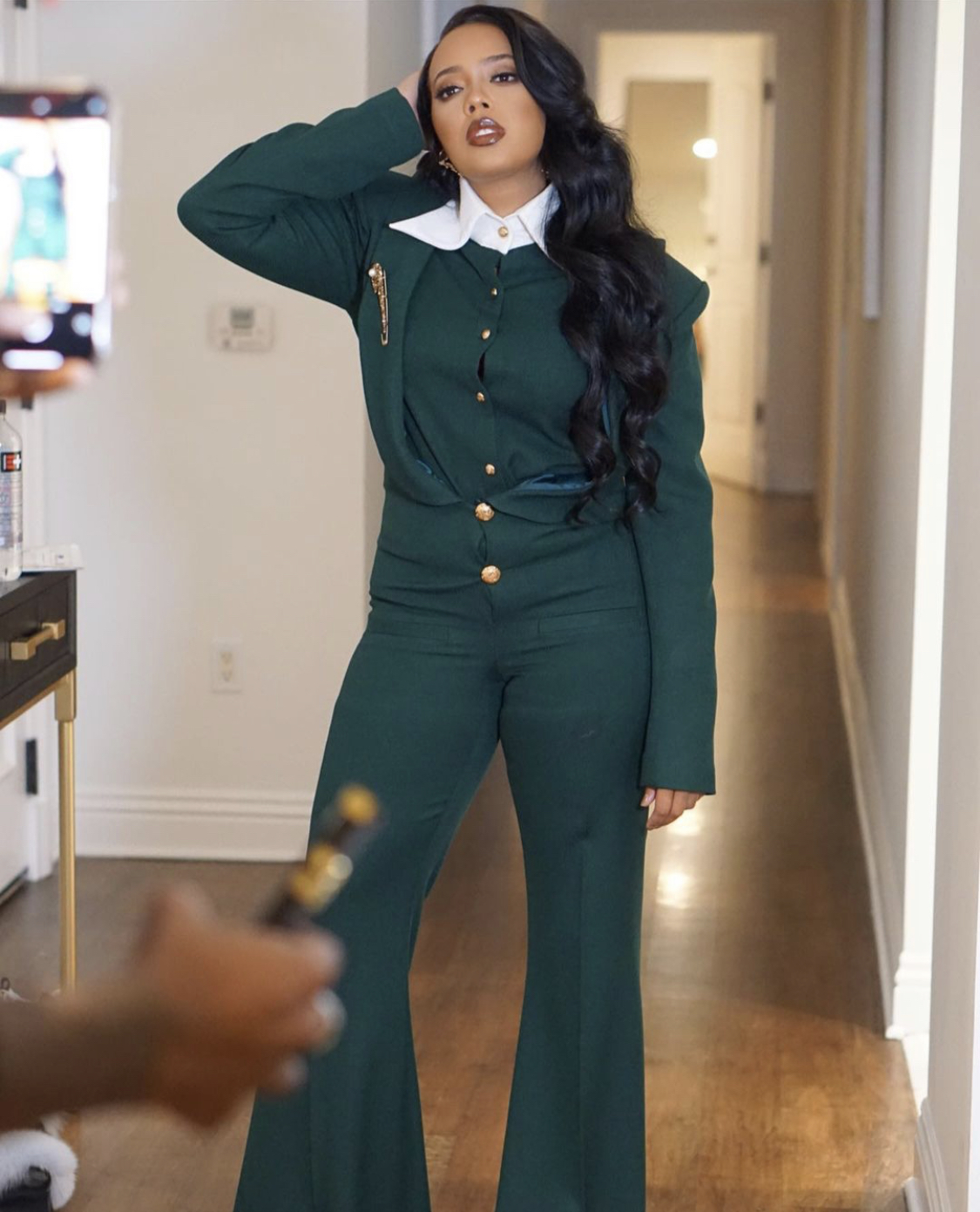 'The Buttons Finna Burst': Fans Are Torn Over Angela Simmons’ Emerald Look