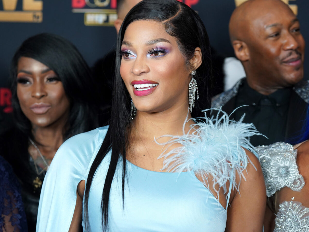 Joseline Hernandez observing the unfolding dramaJoseline's watchful eyeHernandez taking note of the tension