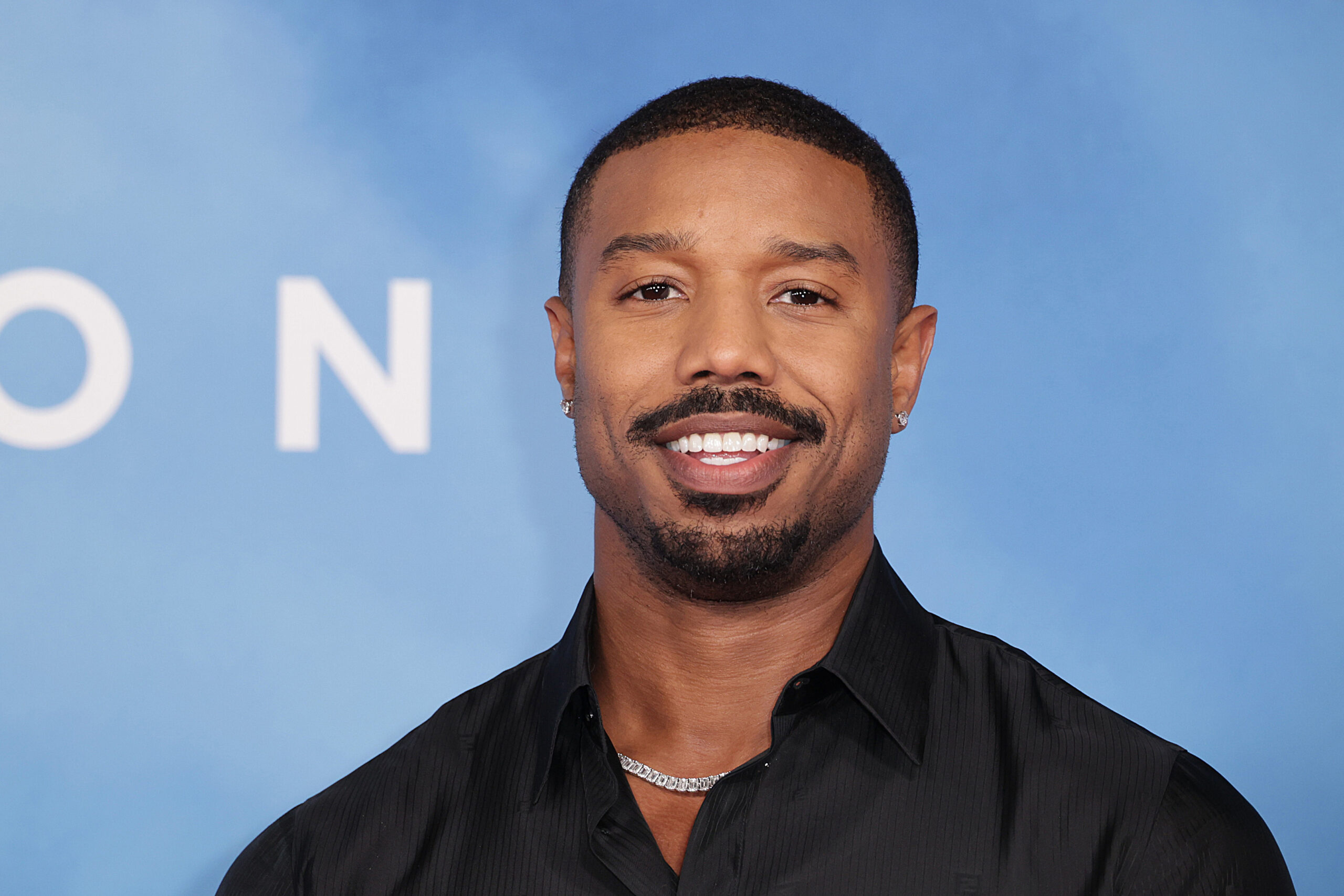 Michael B. Jordan is ever the stylish star while attending a basketball  game in Atlanta