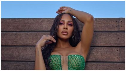 Meagan Good poses in curve-hugging money green dress for her 42nd birthday.