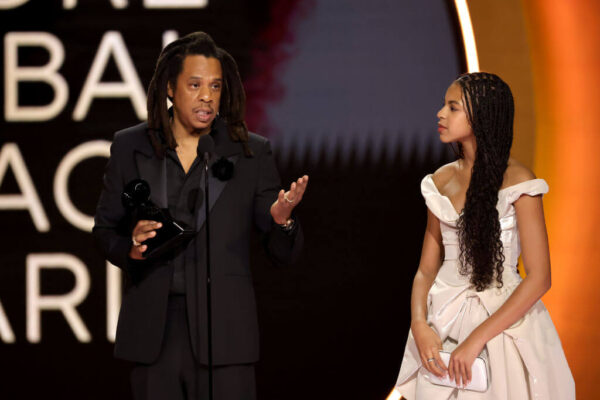 LOS ANGELES, CALIFORNIA - FEBRUARY 04: (LR) Honoree Jay-Z accepts the Dr. Dre Global Impact Award with Blue Ivy Carter onstage during the 66th GRAMMY Awards at Crypto.com Arena on February 04, 2024 in Los Angeles, California. (Photo by Kevin Winter/Getty Images for The Recording Academy)