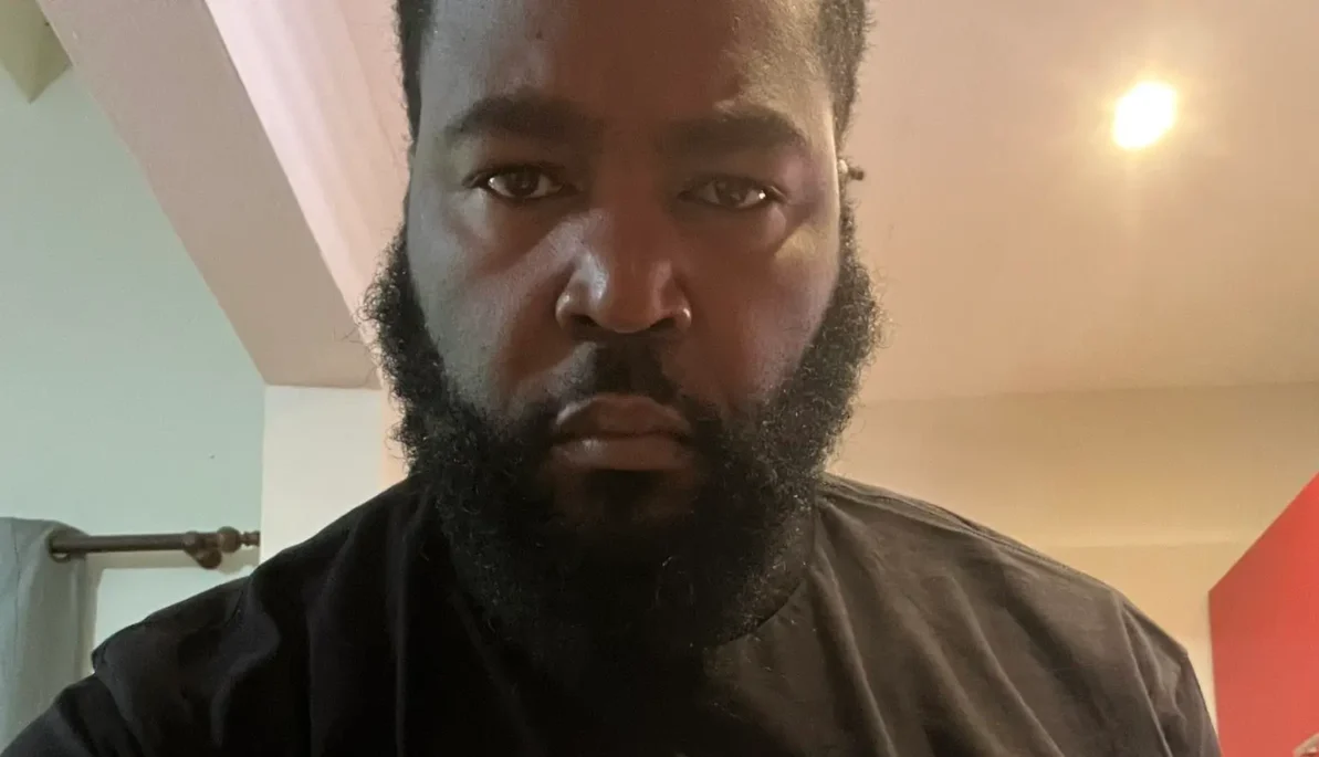 Dr. Umar Johnson's Instagram livestream was interrupted after Police responded to a complaint made of a 'Black Man In a Plaid Shirt' talking to himself at the airport. (Photos: @drumarjohnson / X)