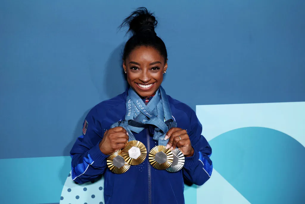 PARIS, FRANCE - AUGUST 05: Simone Biles of Team United States poses with her Paris 2024 Olympic medals following the Artistic Gymnastics Women's Floor Exercise Final on day ten of the Olympic Games Paris 2024 at Bercy Arena on August 05, 2024 in Paris, France. (Photo by Naomi Baker/Getty Images)