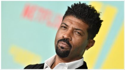 Deon Cole claims a woman threatened him during a trip to see the movie, "The Color Purple," which he starred in.