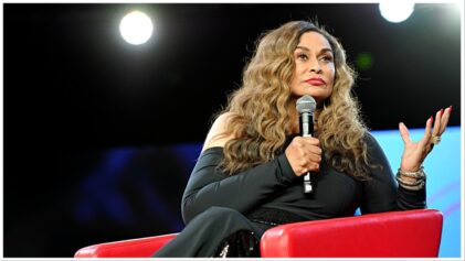 Mama Tina Knowles has a stare down with paparazzi swarming her daughter Beyoncé's during her grandson's fashion show.