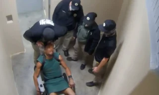 : White Georgia Guard Sued After Video Shows Him Choking Restrained Black Inmate with Leg Chains