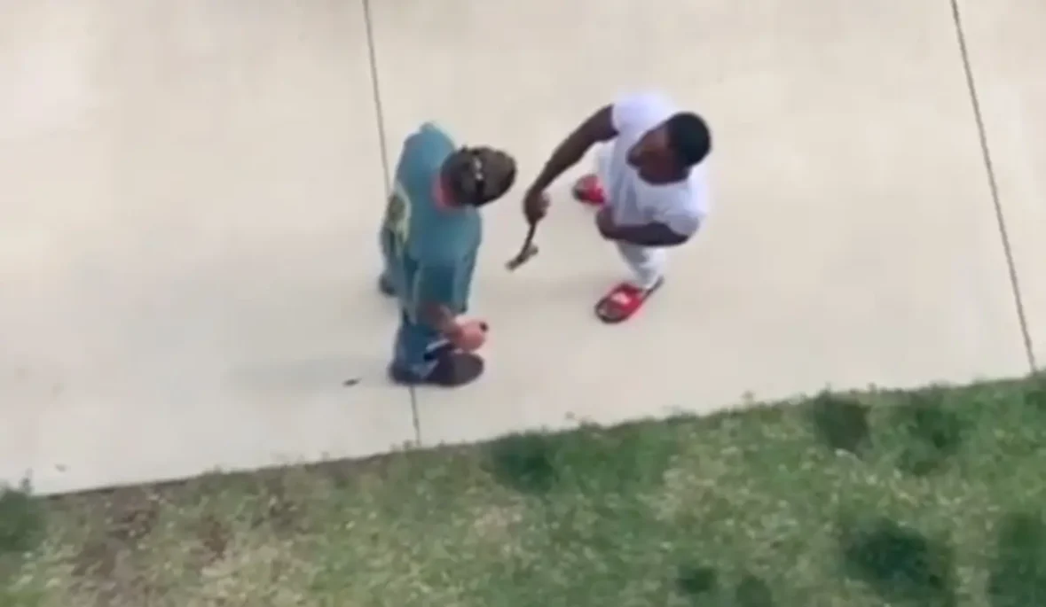 Viral video shows a black man armed with a hammer confronting a man who called him a racial slur before the argument escalated into a physical fight